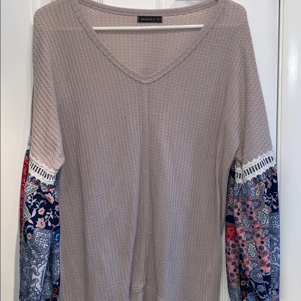 Tan shirt multi color sleeve. Good condition.